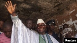 Sierra Leone's president Ernest Bai Koroma waves to supporters after voting in the capital Freetown, November 17, 2012.
