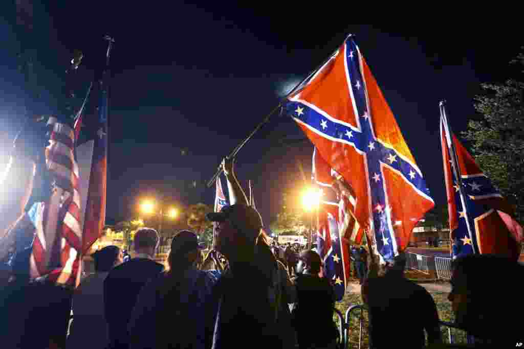 Demonstrators who support keeping Confederate era monuments, protest before the Jefferson Davis statue was taken down in New Orleans, Louisana, USA.