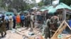 Somali soldiers gather near the destroyed restaurant in Mogadishu, Sept, 7, 2013. 