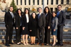 The seven children and wife of Robert Levinson, an American missing in Iran since 2007, appear outside U.S. District Court in Washington, Dec. 4, 2019, as they sue Iran for damages for his disappearance.