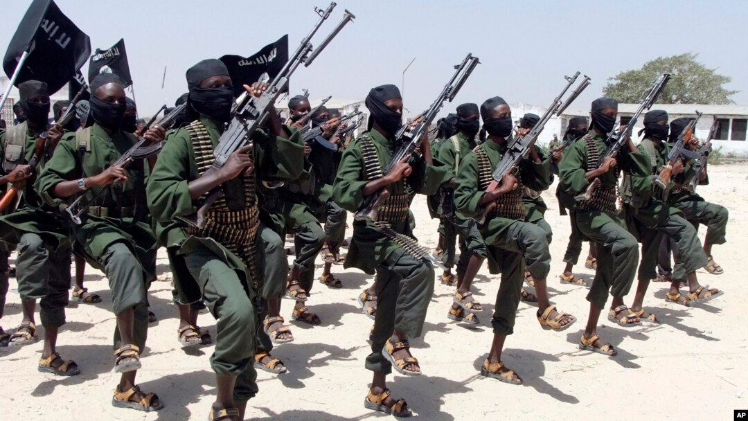 FILE - Hundreds of al-Shabab fighters perform military exercises in the Lafofe area 18 kilometers south of Mogadishu, Somalia, Feb. 17, 2017. 