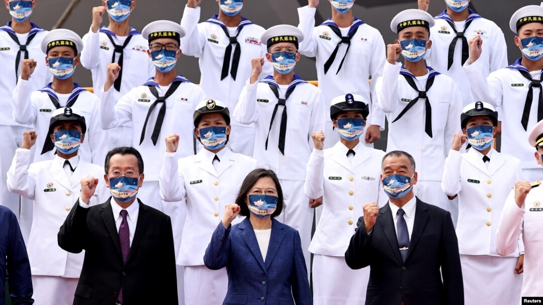 Taiwan President Tsai Ing-wen takes a group photo at a delivery ceremony for the Navy's Yushan amphibious landing dock in Kaohsiung