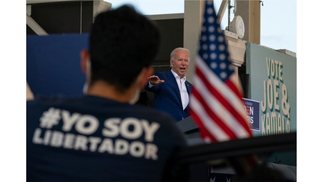 Democratic presidential candidate former Vice President Joe Biden speaks at Miramar Regional Park in Miramar, Fla., Tuesday Oct. 13, 2020, as supporters watch from their cars.