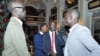 Grang Demebia (l), the son of late Sudanese politician John Garang, who is in the group supporting ousted Vice President Riek Machar, as Grang Demebiar arrives with unidentified delegates in Addis Ababa, Jan. 2, 2014.
