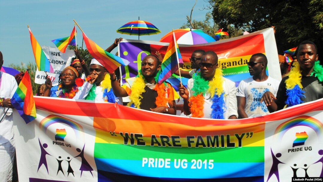 People who identified themselves as members of the lesbian, gay, bisexual and transgender (LGBT) community parade in Entebbe, southwest of Uganda's capital, Kampala, Aug. 8, 2015. 