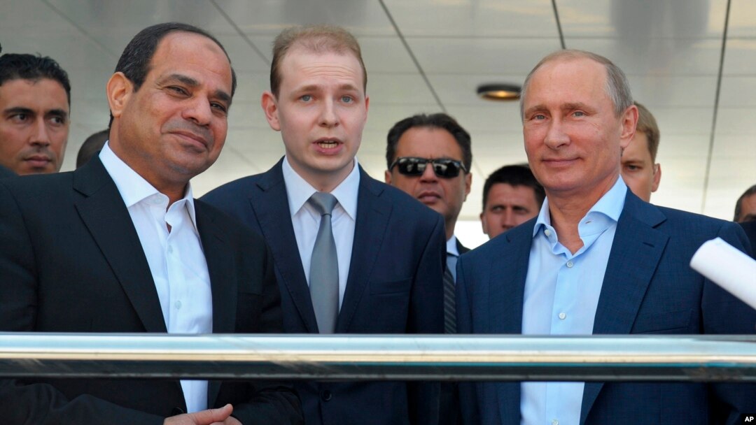 Russian President Vladimir Putin, right, and Egyptian President Abdel-Fattah el-Sissi, second left, listen to a translator during a meeting in the Russian Black Sea resort of Sochi, Russia, Aug. 12, 2014.