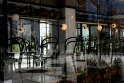 FILE - An empty restaurant is seen in Manhattan borough following the outbreak of coronavirus disease (COVID-19), in New York City, U.S., March 15, 2020.