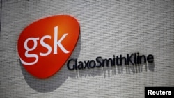 The logo of GlaxoSmithKline (GSK) is seen on its office building in Shanghai, China,July 12, 2013. 