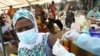 A resident receives a vaccine as the campaign against Ebola continues in Alakro, the slum where the first case of Ebola was confirmed, in Abidjan, Ivory Coast, August 17, 2021. 