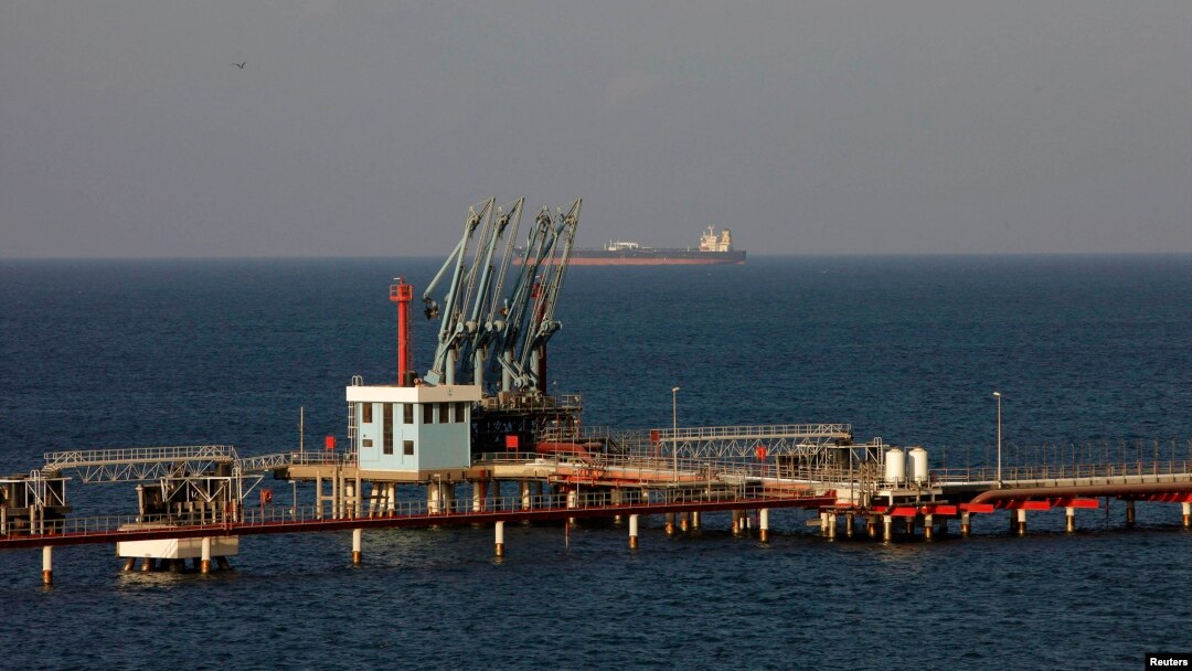 FILE - A view of pipelines and a loading berth of the Hariga oil port in the city of Tobruk, east of Tripoli, Libya.