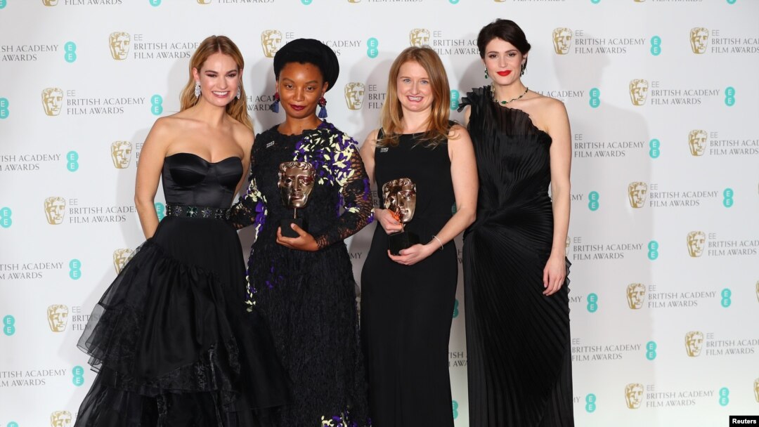 Rungano Nyoni and Emily Morgan hold their awards for an Outstanding Debut by A British Writer, Director or Producer for 'I Am Not A Witch' with citation readers Lily James and Gemma Arterton at the British Academy of Film and Television Awards (BAFTA) at the Royal Albert Hall in London, Britain, Feb. 18, 2018. 
