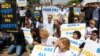 Journalists protest outside the Egyptian Embassy in Nairobi, Kenya and demand the release of their colleagues held in Egypt, Feb. 4, 2014. (Mohammed Yusuf/VOA)
