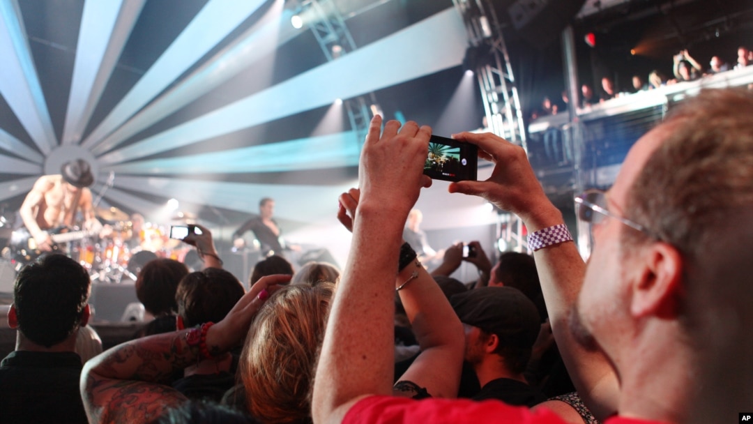 Mark Vopel records Jane's Addiction performance on the LG Thrill 4G, a glasses free 3D smartphone, at the 3D User-Generated Concert, July 25, 2011 in New York.