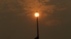 The sun, muted by smoke, is visible in Portland, Ore., Sept. 5, 2017. Dozens of fires across the Western U.S. and Canada blanketed the air with choking smoke from Oregon to Colorado, where health officials issued air quality alerts.