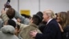 U.S. President Donald Trump and first lady Melania Trump take a selfie with U.S. troops at Ramstein Air Force Base, Germany, Dec. 27, 2018. 