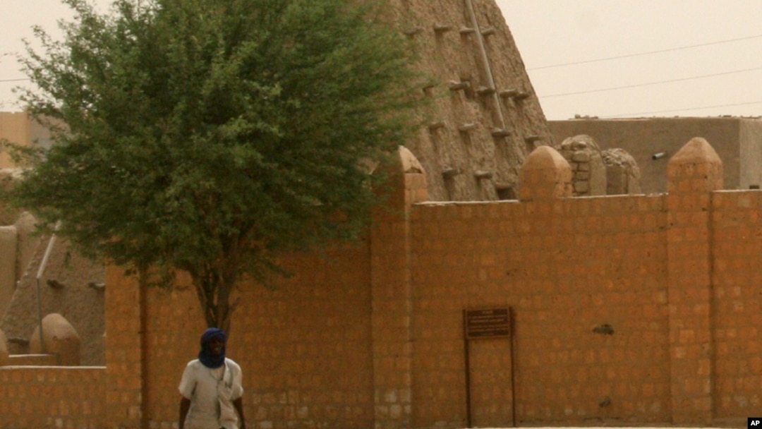 A man walks past the Sankore Mosque, a UNESCO World Heritage Site, in Timbuktu, Mali, April 11, 2012.