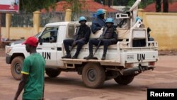 FILE - United Nations peacekeepers ride a pickup truck while on patrol in Bangui, Central African Republic, April 24, 2017. 