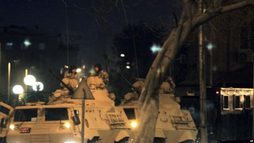 Egyptian army armored vehicles patrol a street in Cairo following protests in Cairo, Egypt, Jan 28, 2011