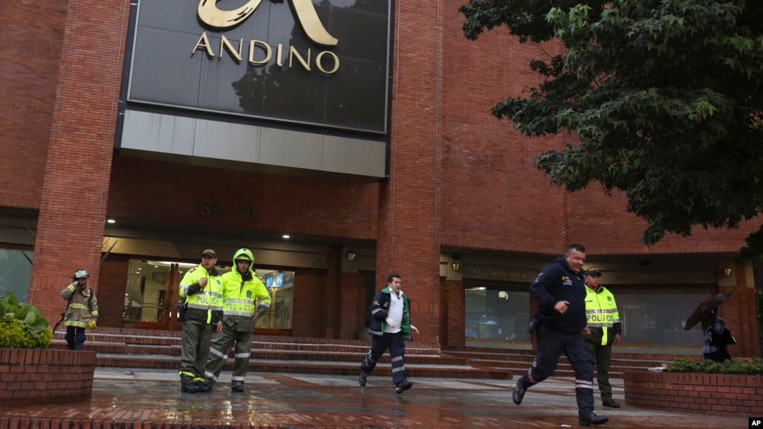 Police officers and safety personnel stand at the entrance of the Centro Andino shopping center after and explosion rocked the building, in Bogota, Colombia, June 17, 2017.
