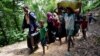 Rohingya people walk toward the makeshift shelter near the Bangladesh-Myanmar border in Cox’s Bazar, Bangladesh, Aug. 28, 2017.