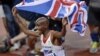 Britain's Mo Farah celebrates winning gold in the men's 10,000-meter final during the athletics in the Olympic Stadium at the 2012 Summer Olympics, London, August 4, 2012.