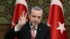 Turkey's President Recep Tayyip Erdogan gestures as he addresses local administrators, in Ankara, Turkey, Wednesday, Feb. 8, 2017. In a sign of ameliorating ties, Turkish officials said Wednesday that U.S. President Donald Trump looked "positively" on two
