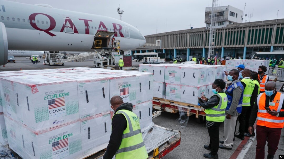 FILE - Officials receive boxes of Moderna coronavirus vaccine at the airport in Nairobi, Kenya, Sept. 6, 2021. 