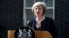 FILE - British Prime Minister Theresa May, shown speaking to reporters in London, July 13, 2016, says suspending parts of the convention during conflict would allow British troops to take "difficult decisions" on the battlefield without fear of having dubious legal claims filed against them later.