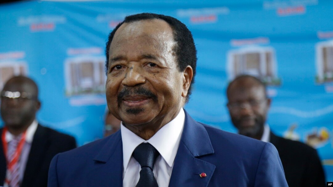 In this Oct. 7, 2018 photo, Cameroon's Incumbent President Paul Biya waits to casts his vote during the presidential elections in Yaounde, Cameroon. 