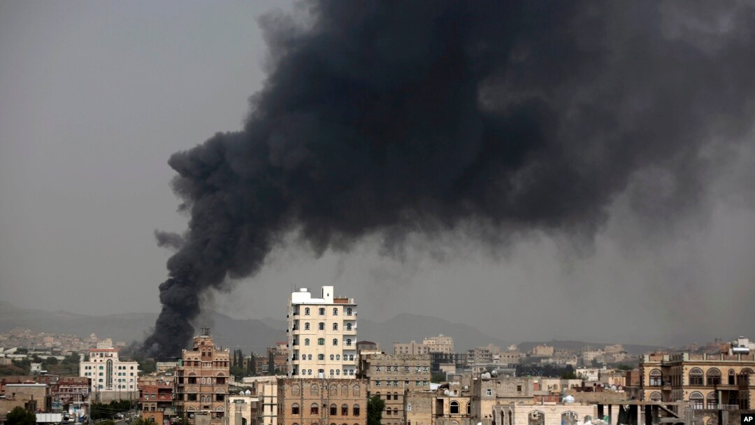 FILE - Smoke rises after Saudi-led airstrikes hit a food factory in Sanaa, Yemen, Aug. 9, 2016. 