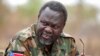 South Sudan's rebel leader Riek Machar speaks to rebel General Peter Gatdet Yaka (not seen) in a rebel controlled territory in Jonglei State, Feb. 1, 2014. 