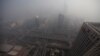 Buildings and the Guomao Bridge are pictured amid heavy haze and smog in Beijing, October 29, 2011. 