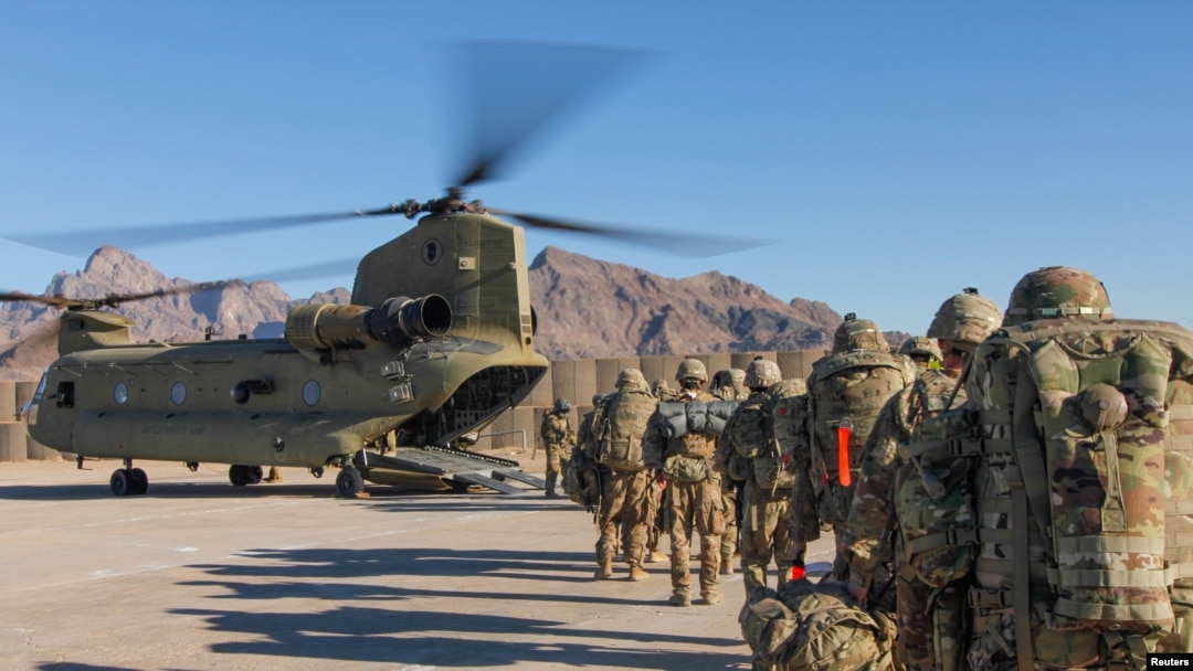 FILE - U.S. soldiers load onto a Chinook helicopter to head out on a mission in Afghanistan, Jan. 15, 2019.