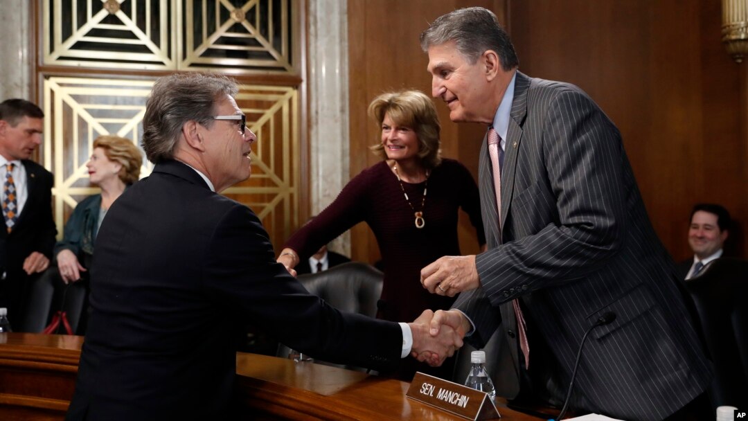 Energy Secretary Rick Perry, left, speaks with Sen. Joe Manchin, D-W.Va., right, ranking member of the Senate Energy and Natural Resources Committee, and committee chairwoman, Sen. Lisa Murkowski, R-Alaska, before testifying April 2, 2019, on Capitol Hill.