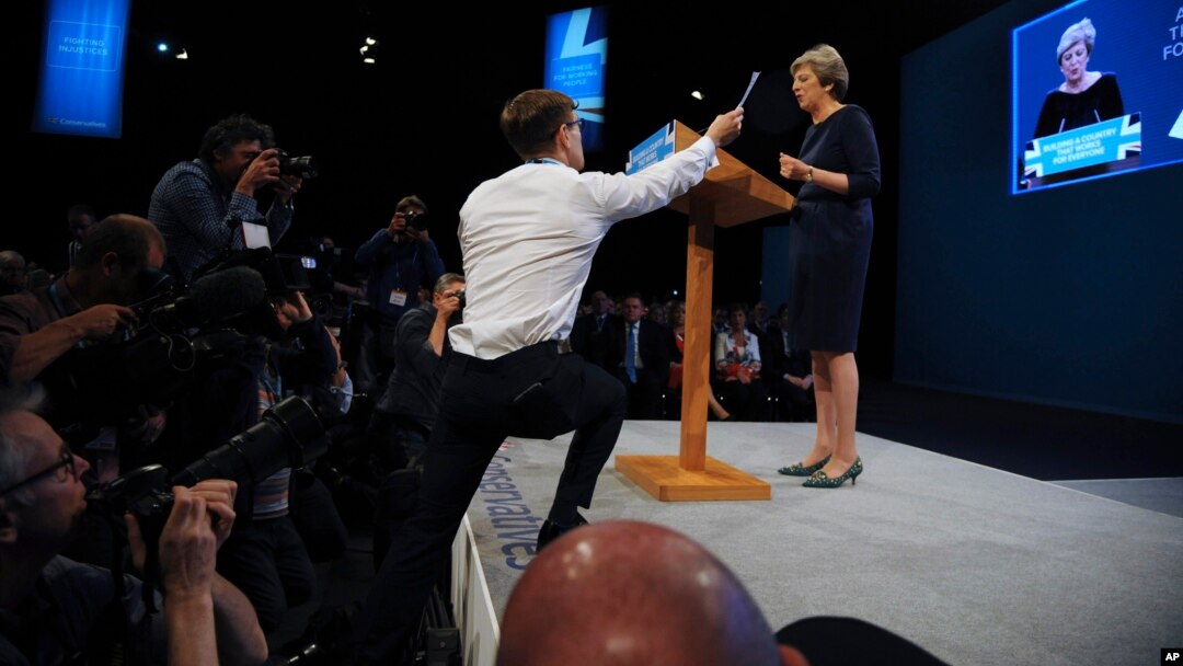 Comedian Simon Brodkin, also known as Lee Nelson, interrupts the Conservative Party Leader and Prime Minister, Theresa May, during her speech at the Conservative Party Conference at Manchester Central, in Manchester, England, Oct. 4, 2017.
