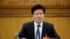 中共新疆自治区党委书记张春贤3月10日在人大会议新疆组会上回答问题。