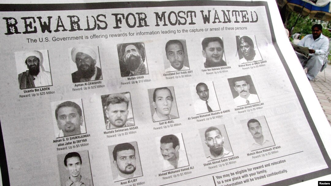 FILE - In notice offering rewards for information leading to the capture of most wanted terrorists, Anas el-Liby is bottom row, second from left.