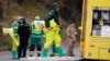 Military forces work on a van in Winterslow, England, March 12, 2018, as investigations continue into the nerve-agent poisoning of Russian ex-spy Sergei Skripal and his daughter, Yulia, in Salisbury, England, on March 4, 2018. 