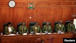 Kenya's Chief Justice Willy Mutunga (3rd L) leads Supreme Court judges (L-R) Njoki Ndung'u, Philip Tunoi, Jackton Ojwang, Mohamed Ibrahim and Smokin Wanjala, in Nairobi, March 30, 2013.