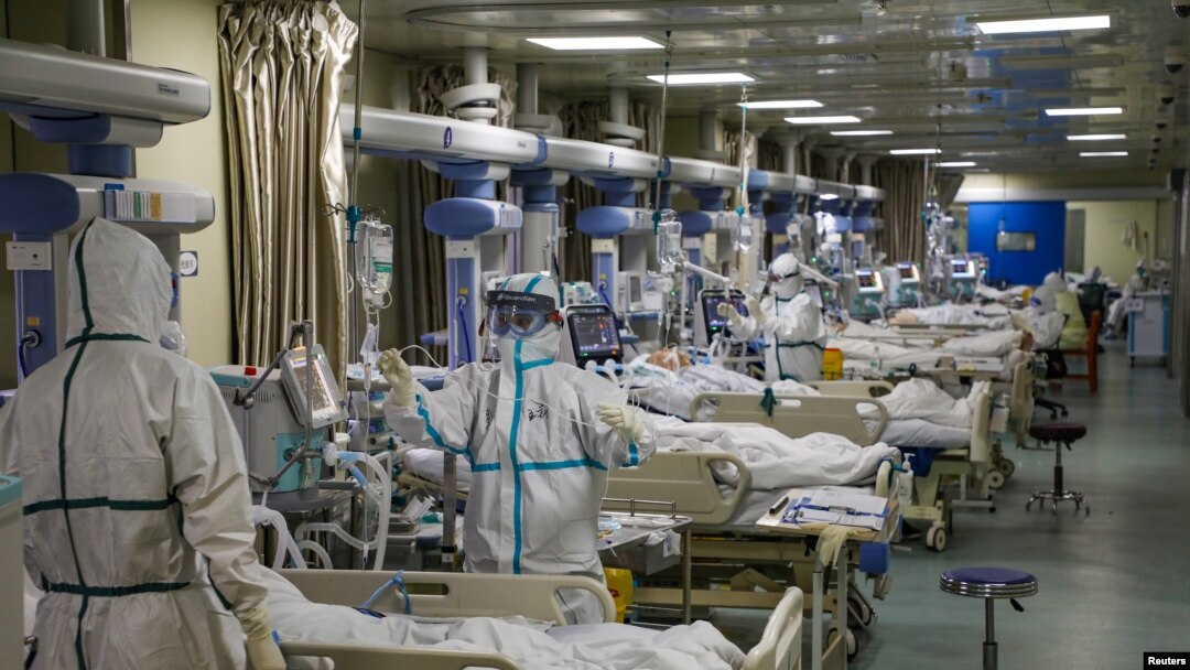 Medical workers in protective suits attend to novel coronavirus patients at the intensive care unit (ICU) of a designated hospital in Wuhan, Hubei province, China, Feb. 6, 2020. (Credit: China Daily)