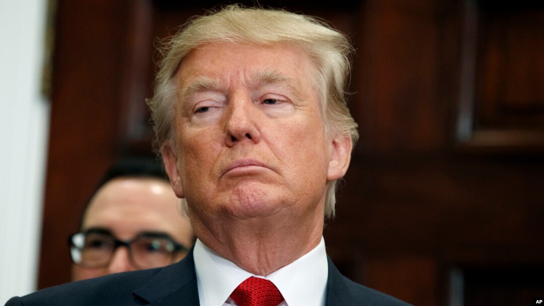 President Donald Trump listens during an event to sign an executive order on health care in the Roosevelt Room of the White House, Oct. 12, 2017, in Washington.