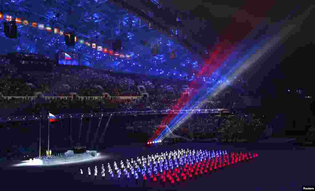The colors of the Russian flag are seen during the opening ceremony of the 2014 Sochi Winter Olympics, Feb. 7, 2014.