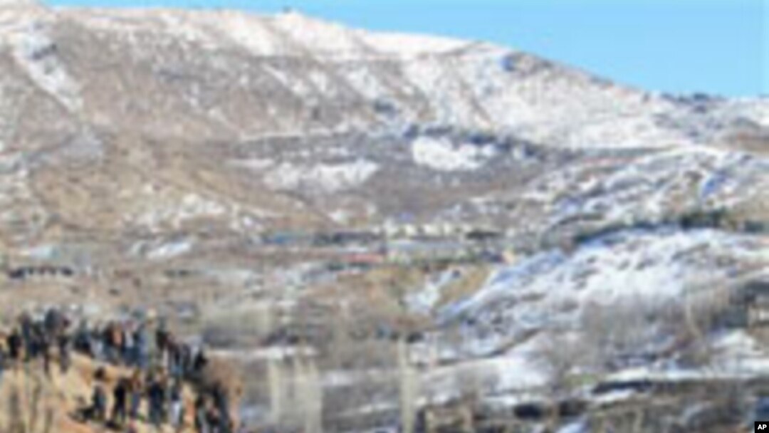 Thousands of mourners gathered in Turkey's Gulyazi village Dec. 30, 2011 for funerals of 35 Kurdish civilians killed in raid by Turkish military jets