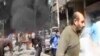 This image taken from video obtained from Ugarit News, which has been authenticated based on its contents and other AP reporting, shows smoke and fire after a fighter jet crashed into a suburb of Damascus, Syria, Feb. 20, 2013.