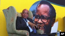 South African president Jacob Zuma, in front of a portrait of former African National Congress president Oliver Tambo, addresses foreign correspondents at a breakfast in Johannesburg, Oct. 29, 2012. 