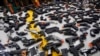 FILE - A collections of toy guns is displayed in a March 4, 2015, photo.