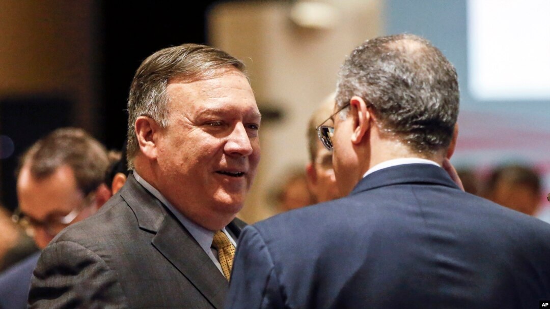 U.S. Secretary of State Mike Pompeo, left, speaks with Russia's Deputy Foreign Minister Igor Morgulov in Singapore, Aug. 4, 2018