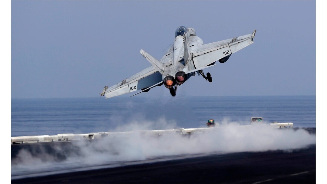 In this picture taken on Nov. 21, 2016, a U.S. Navy fighter jet takes off from the deck of the U.S.S. Dwight D. Eisenhower aircraft carrier.