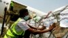 FILE - A shipment of COVID-19 vaccines distributed by the COVAX global initiative arrives in Abidjan, Ivory Coast, Feb. 25, 2021.