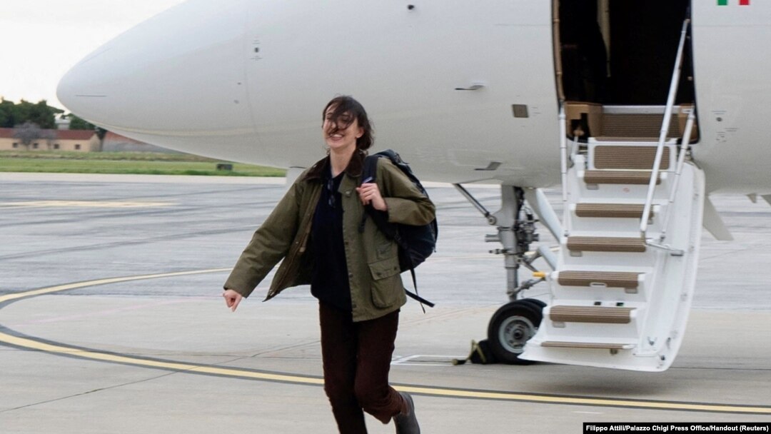 Italian journalist Cecilia Sala walks at Rome's Ciampino military airport in Rome, after she was freed from detention in Iran, Jan. 8, 2025. 